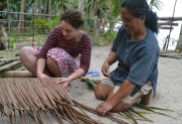 Making roof panels from palm leaves
